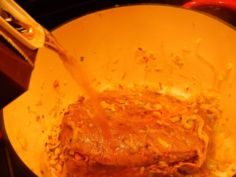 Add enough beef broth to just cover the leeks, about and inch or so will do.