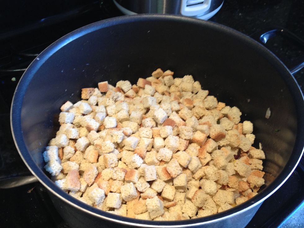 Add enough bread cubes to cover the mix well.
