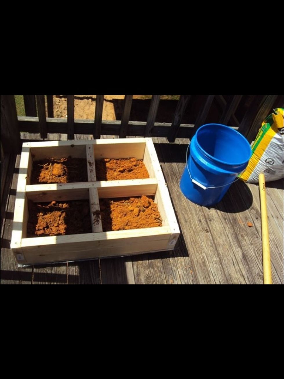 Add enough dirt to fill about 3/5 of each square and then top off with some good herb or crop fertilizer. Mix it all together and get your hands dirty.