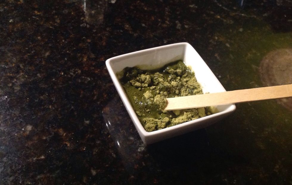 Add enough drops of lemon juice to powder and mix constantly.