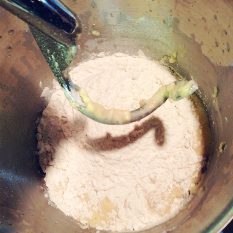 Add enough flour for the dough to become smooth to the touch. The dough should not stick to the side of the mixing bowl.