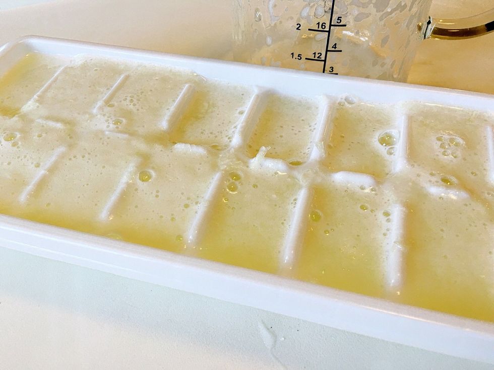 Add enough water in the measuring cup to the lime mixture to fill your tray. Swish the measuring cup around a bit while you pour to evenly distribute the fruit.