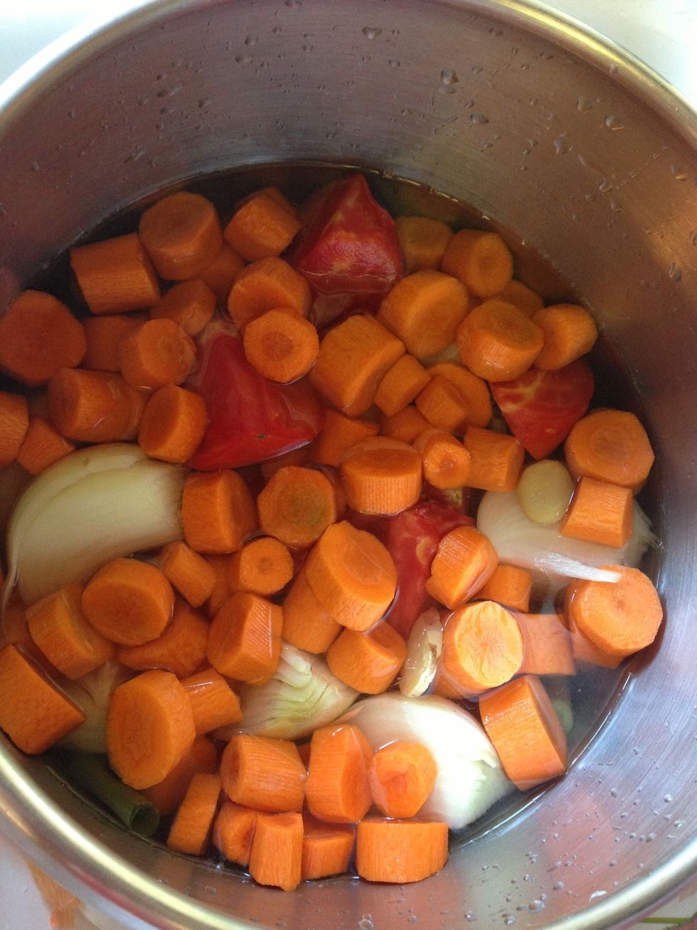 Add enough water to cover the ingredients and some rice wine