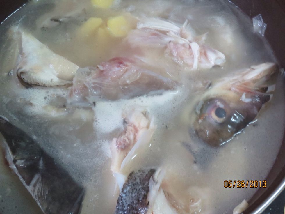 Add enough water to partially cover the fish