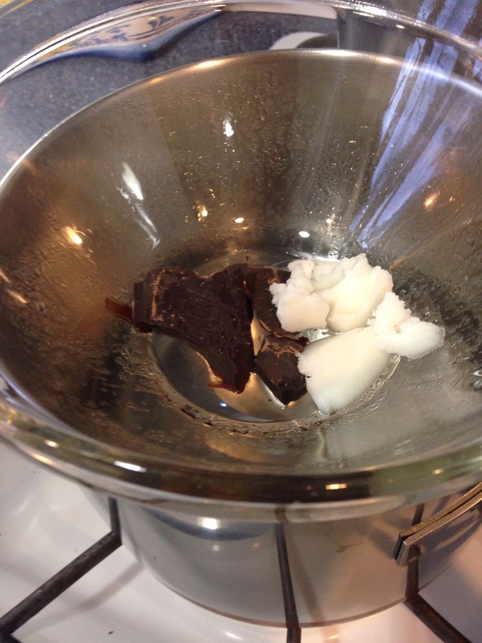 Add equal parts of chocolate and coconut oil in a hot water bath