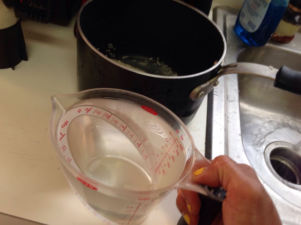 Add equal parts water to rice. 2 cups rice= 2 cups water