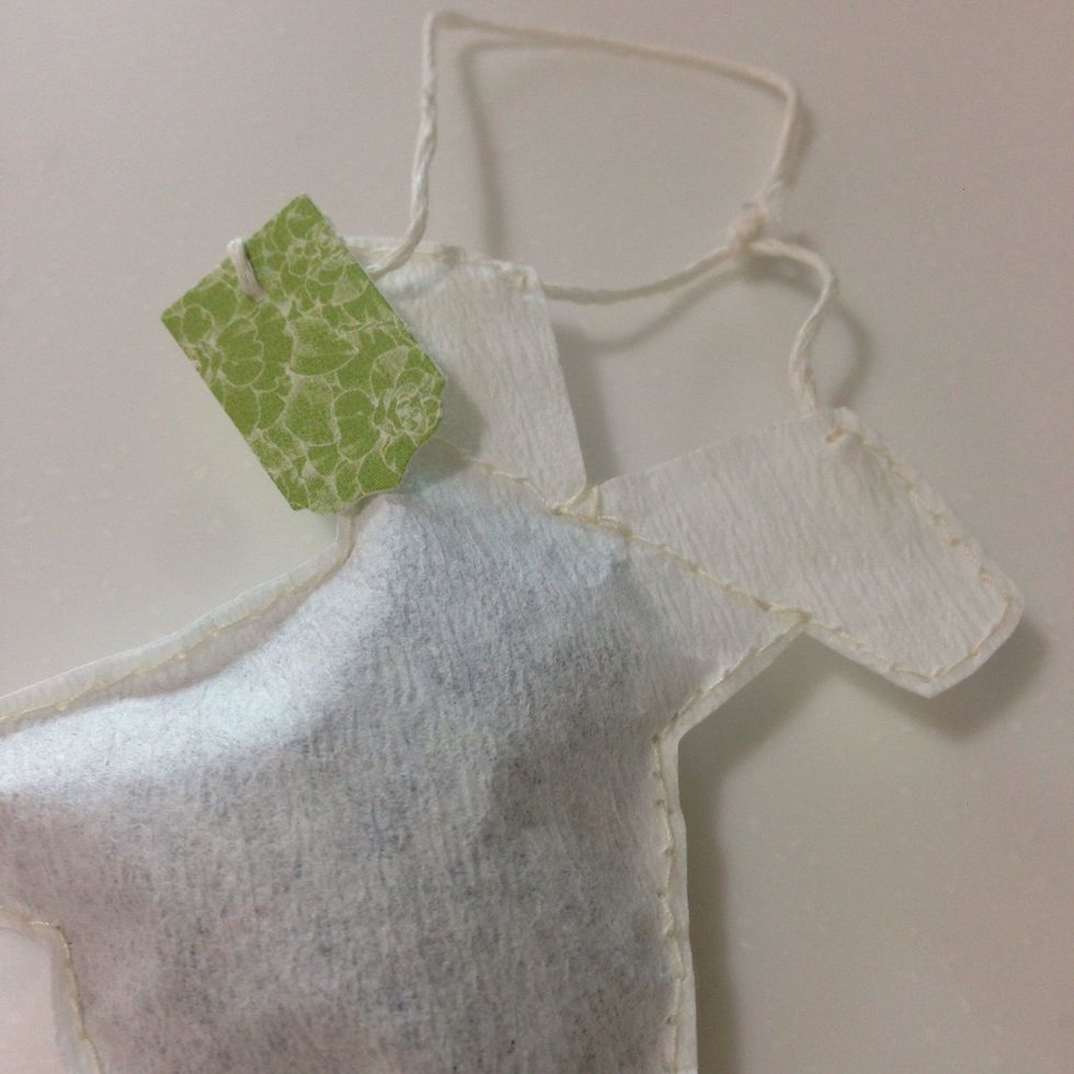 Add extension at the top of the teabag using some cord string to hang the teabag... Finish up by adding a tab at the end... I'm using the banner from the Botanical Tea collection...