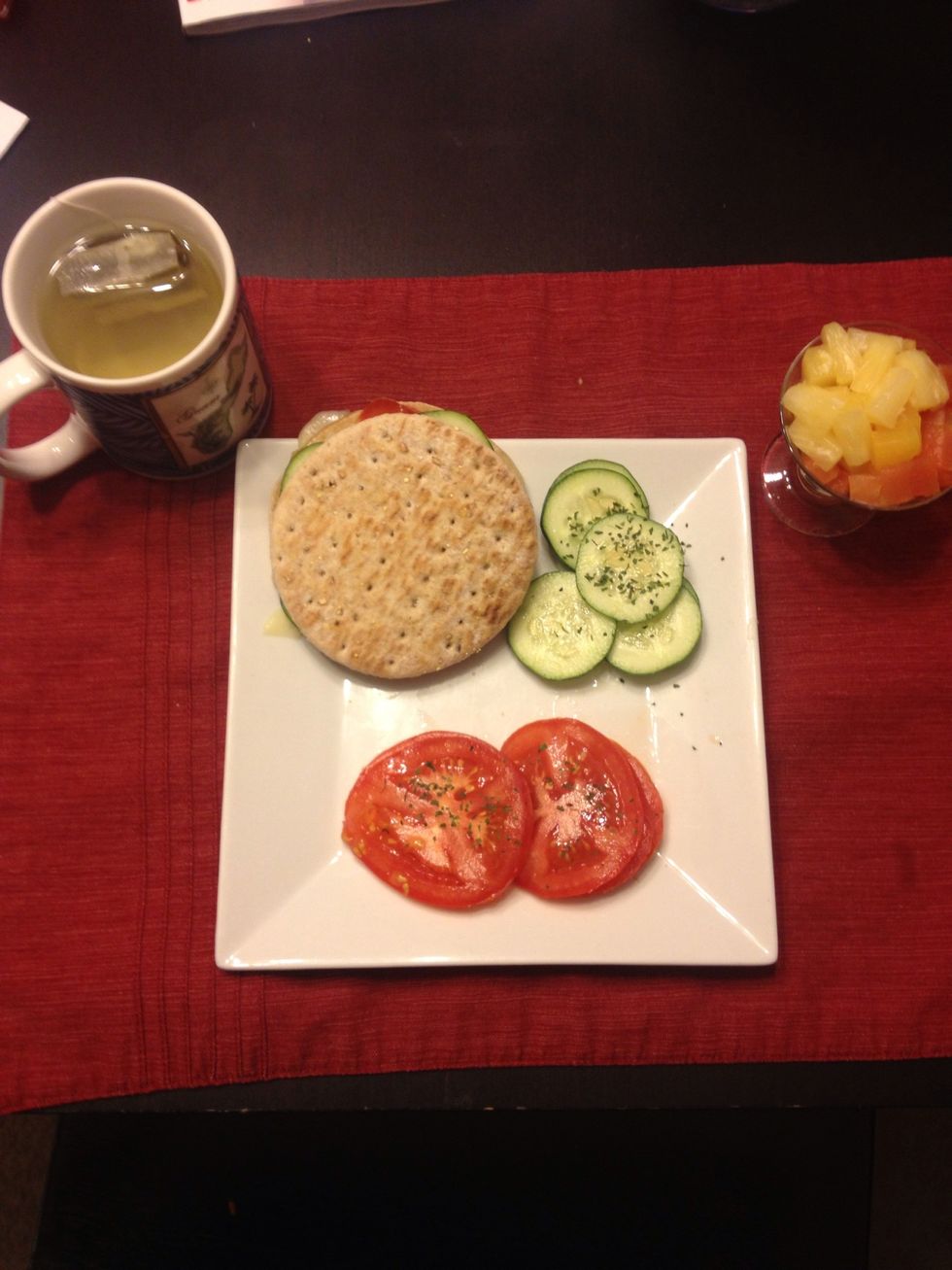 Add extra tomato and cucumbers to plate, grab some green tea and mixed fruit