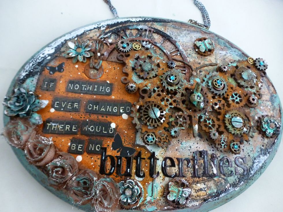 Add eye hooks and chain. I added gesso, patina paint, and black ink to the chain to have it blend with plaque.