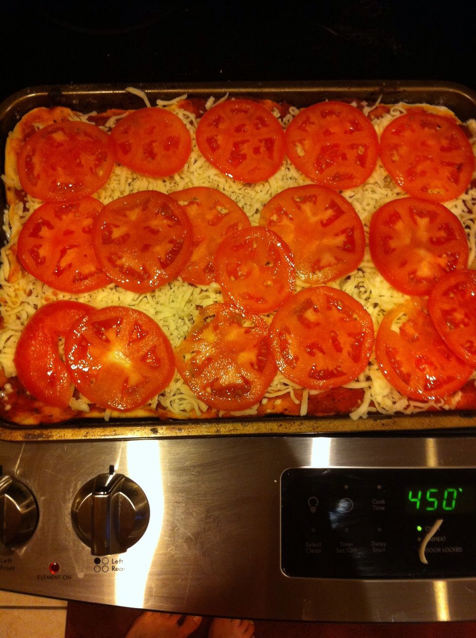 Add favorite toppings (here tomatoes, mozzarella cheese and basil), and take to the oven for another 10-12 min.
