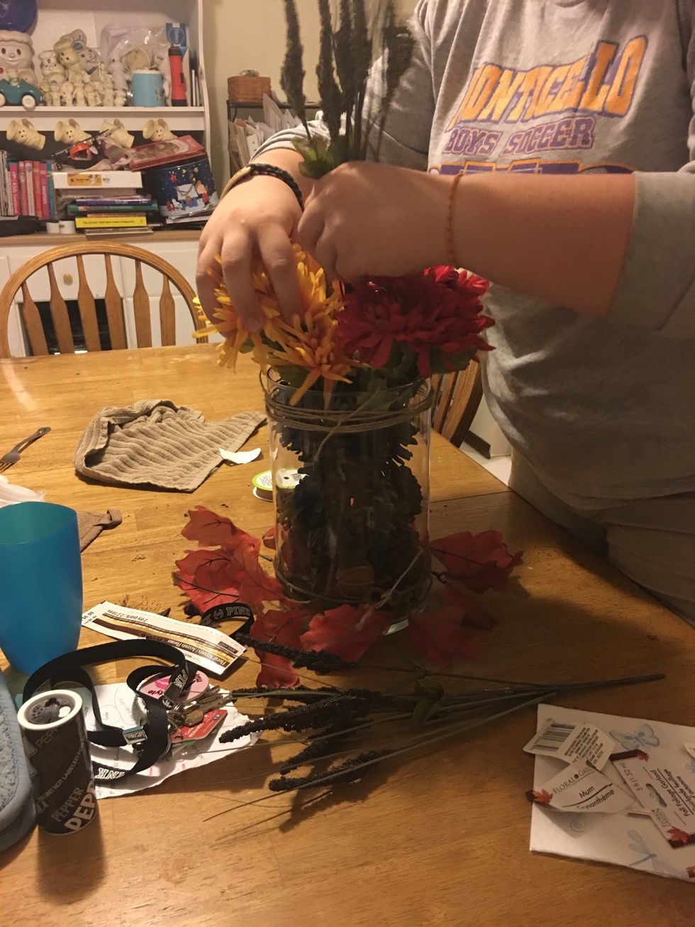 add fillers into the floral arrangement where necessary.