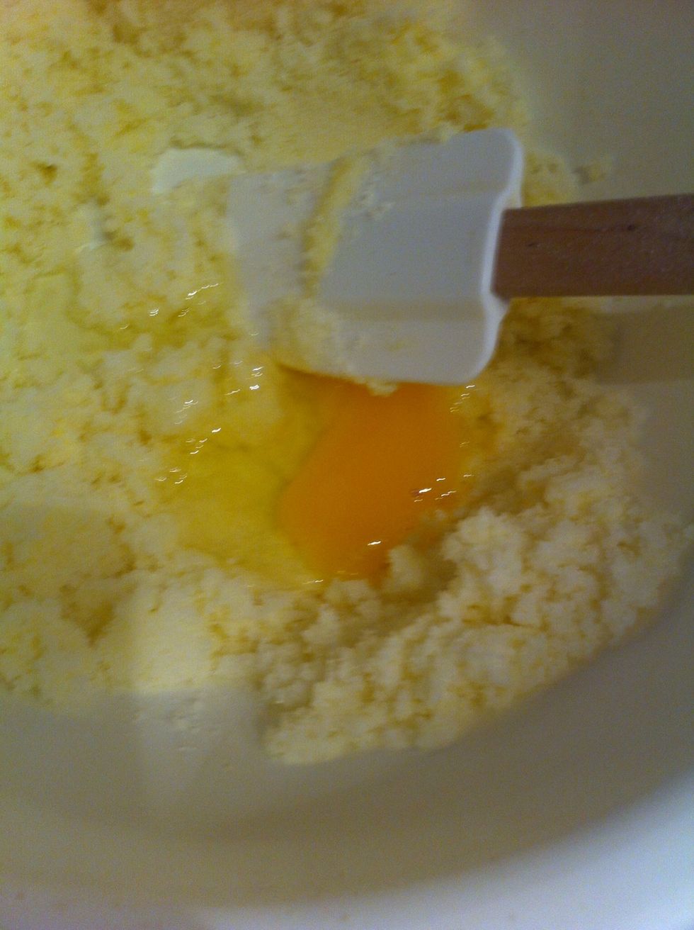 Add first egg and mix well