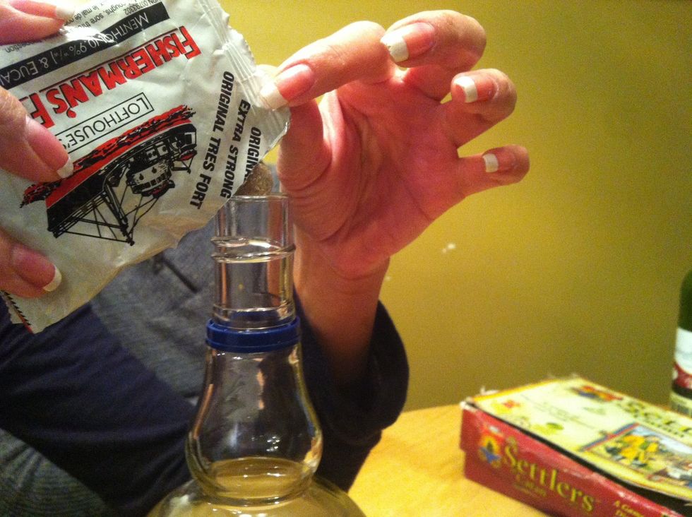 Add Fisherman's Friend to Vodka. 10 Fisherman's friend per 100 ml. (Or approx 3 packs to a 700ml bottle)