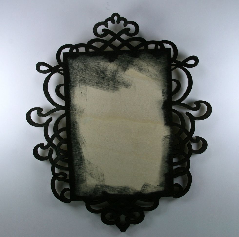 Add flat black acrylic paint to scrolls and 1/4 inch in from edges. Allow to dry.