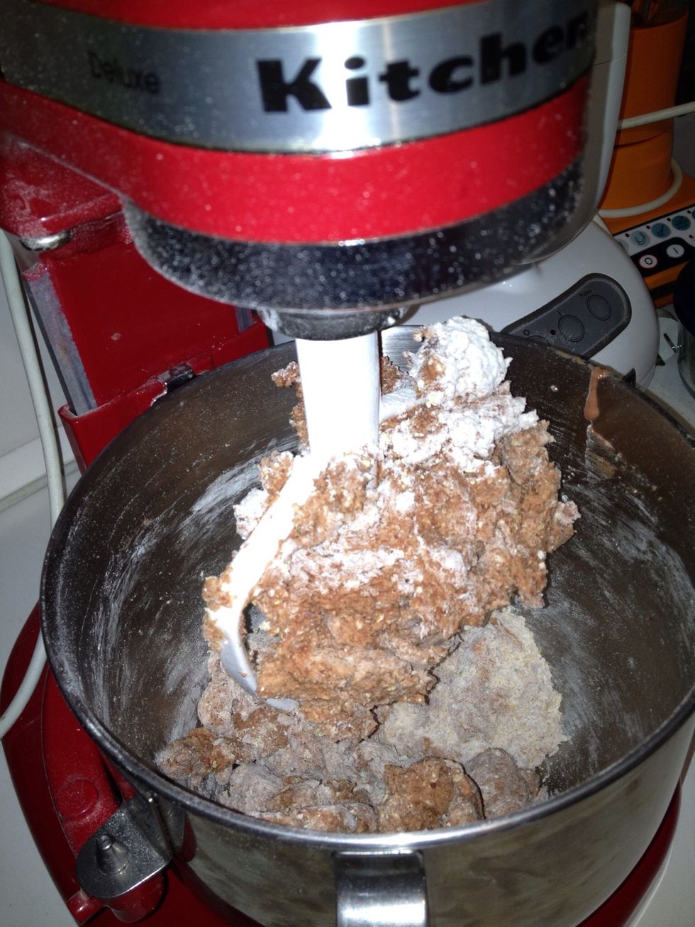 Add flour all at once and mix until stiff and clumping together.