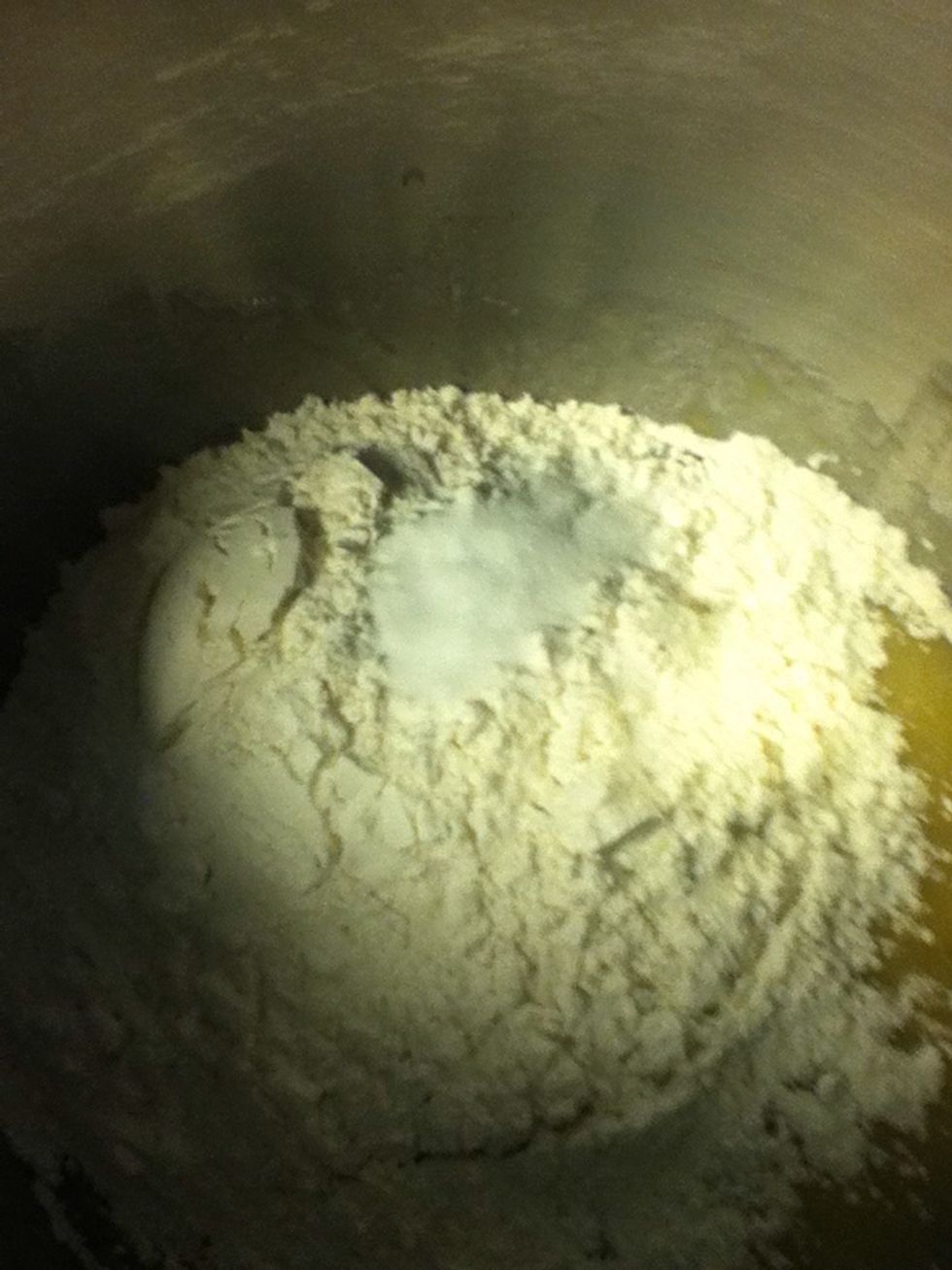 Add flour and baking soda. And mix.