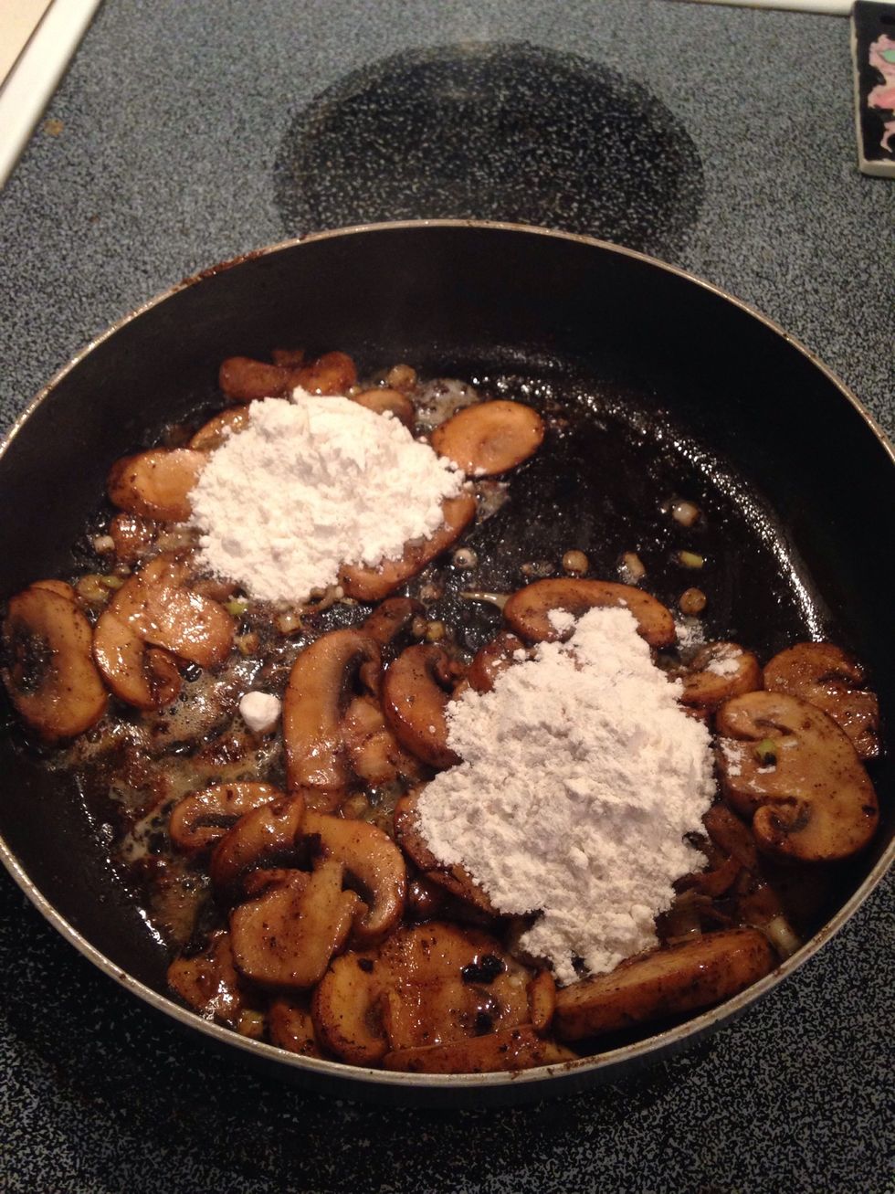 Add flour and stir to make a roux.