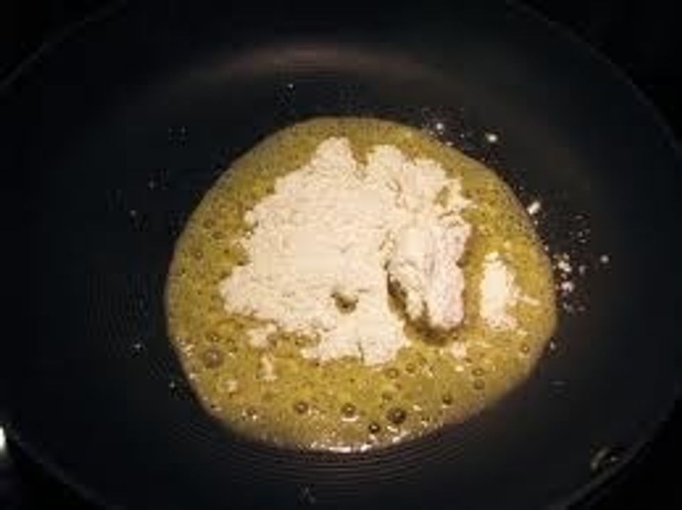 Add flour and whisk until smooth.