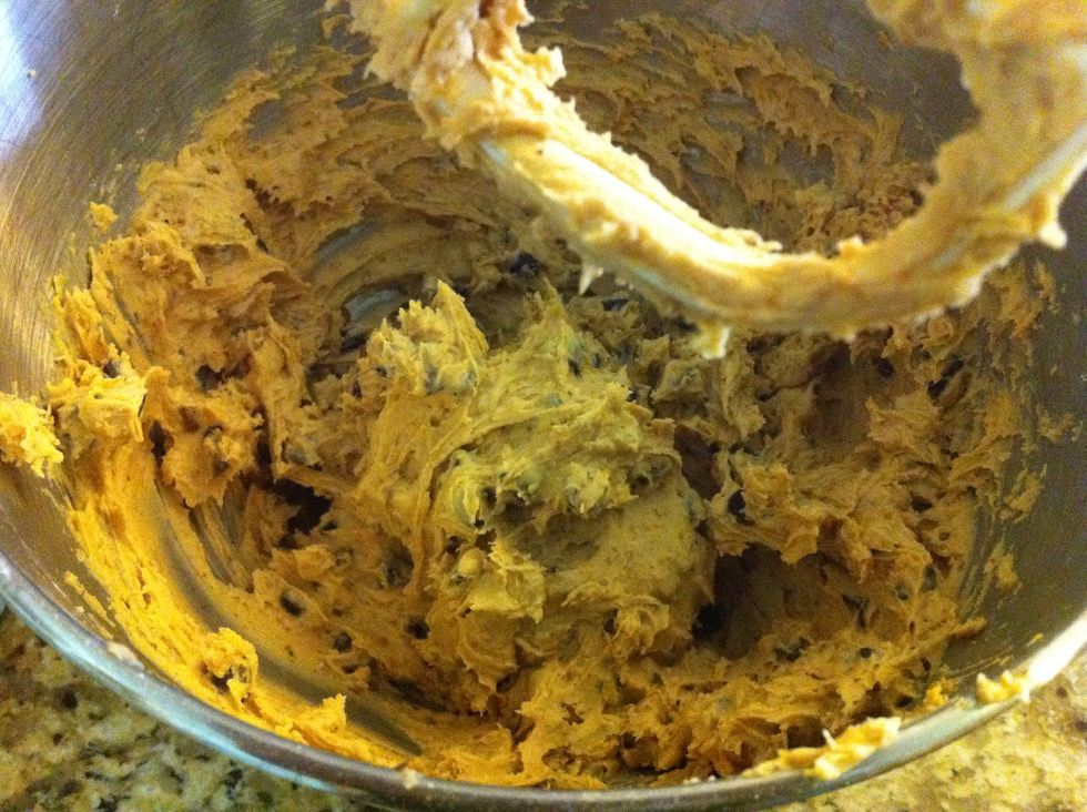 Add flour, baking soda and salt then mix until fully blended. Add chocolate chips and walnuts then mix. Let cookie dough cool in fridge for 20 minutes before cooking. Add spoonfuls to cookie sheet.