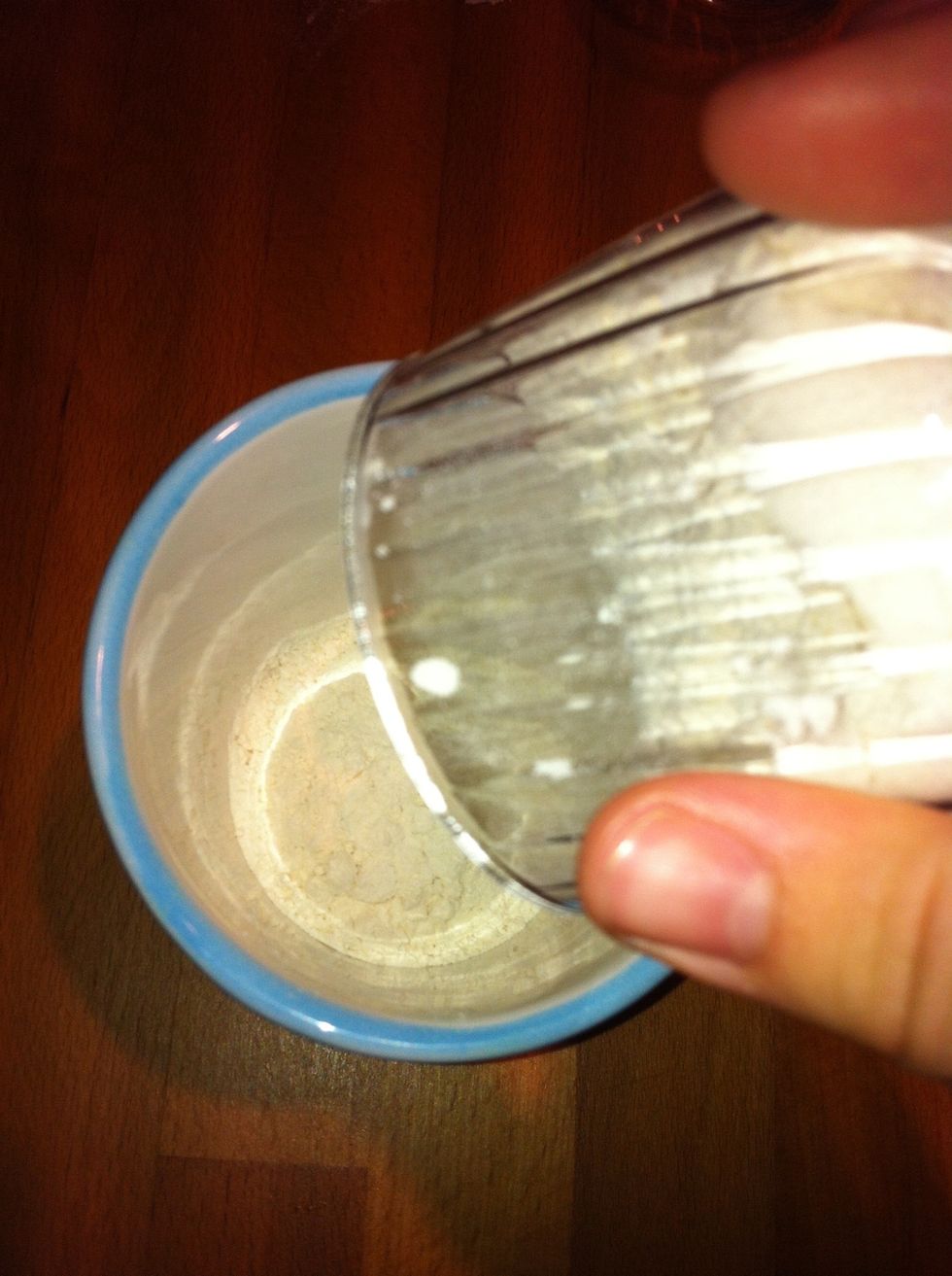 Add flour in the cup.