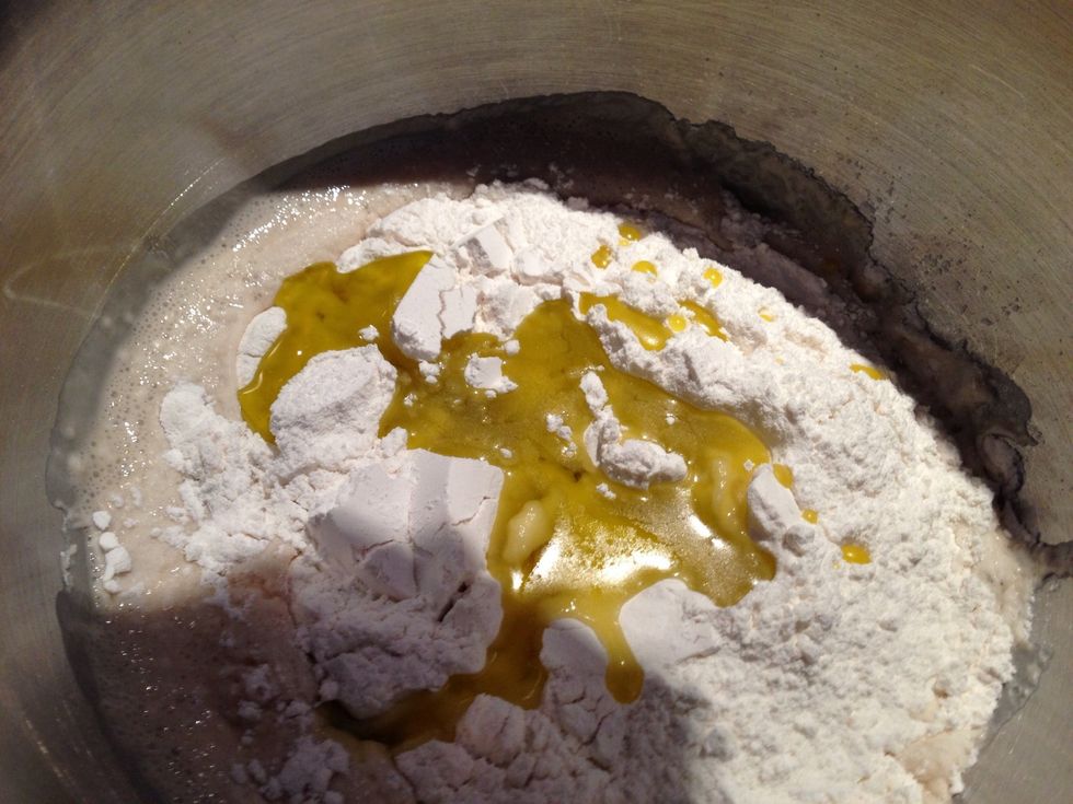 Add flour, salt and olive oil.