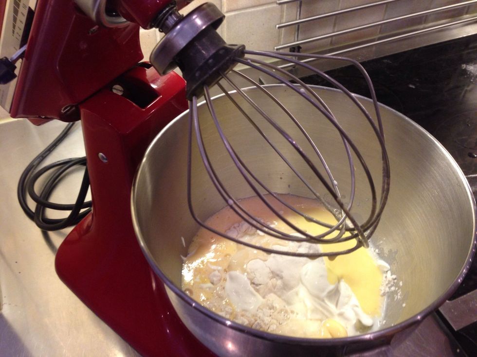 Add flour, sugar, salt, yolks, milk, sour cream and melted butter in a bowl. Mix well.