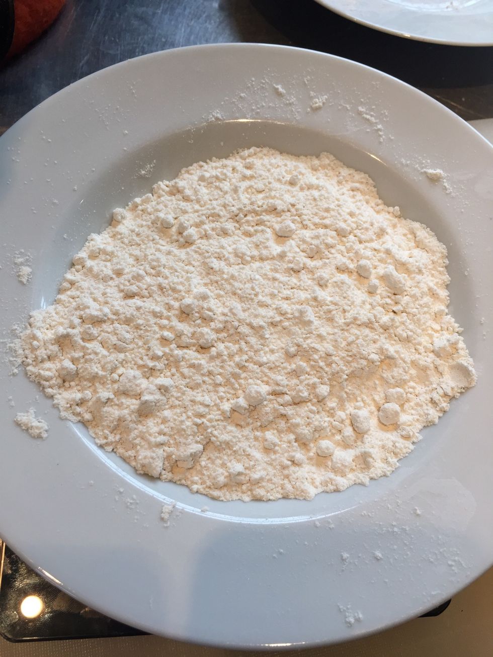 Add flour to a separate bowl.