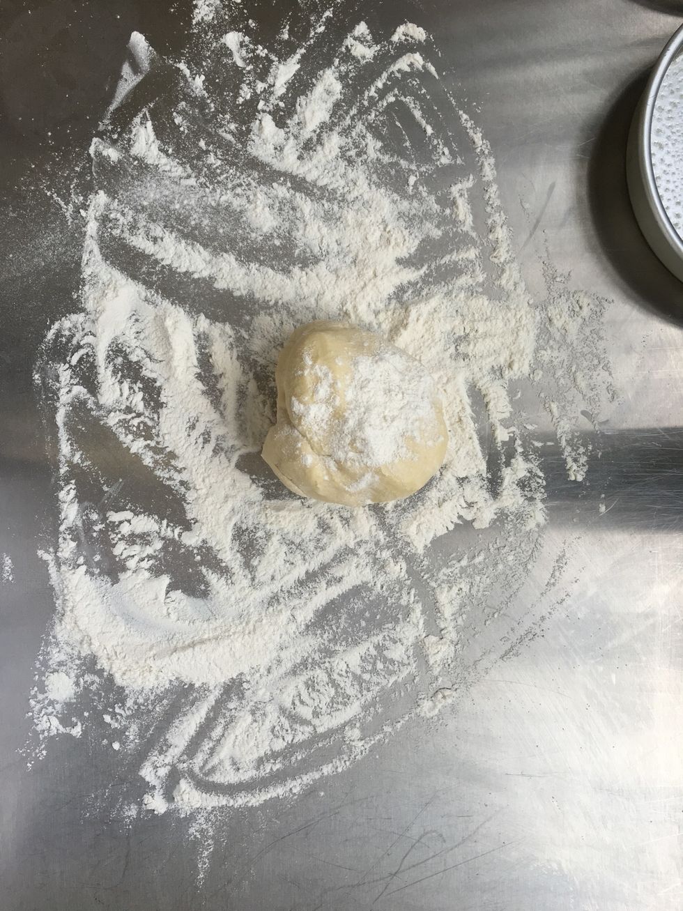 Add flour to board or to the counter, and on top of the dough.