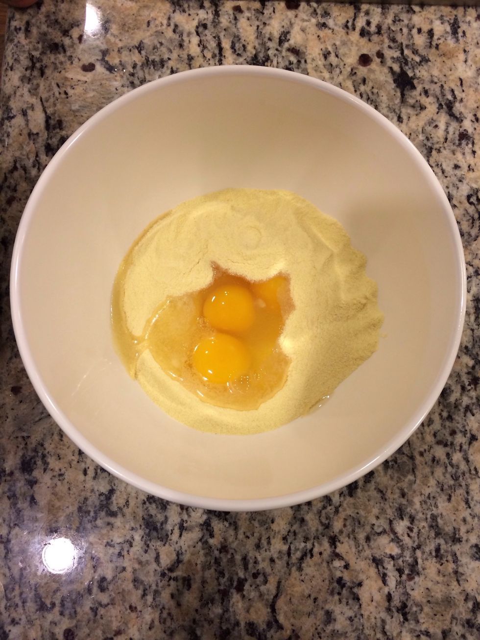 Add flour to bowl. Make a well in the center then add the eggs