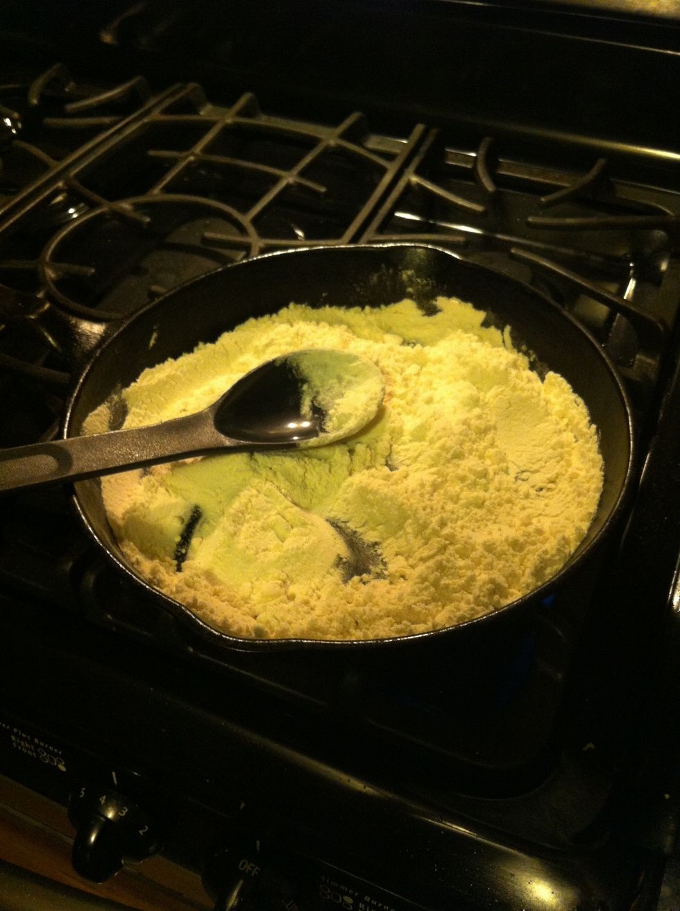 Add flour to skillet and let it sit for small intervals of time to warm and then slowly stir, 10 to 20 seconds or so. we dont want it to actually burn, just brown a very dark color.