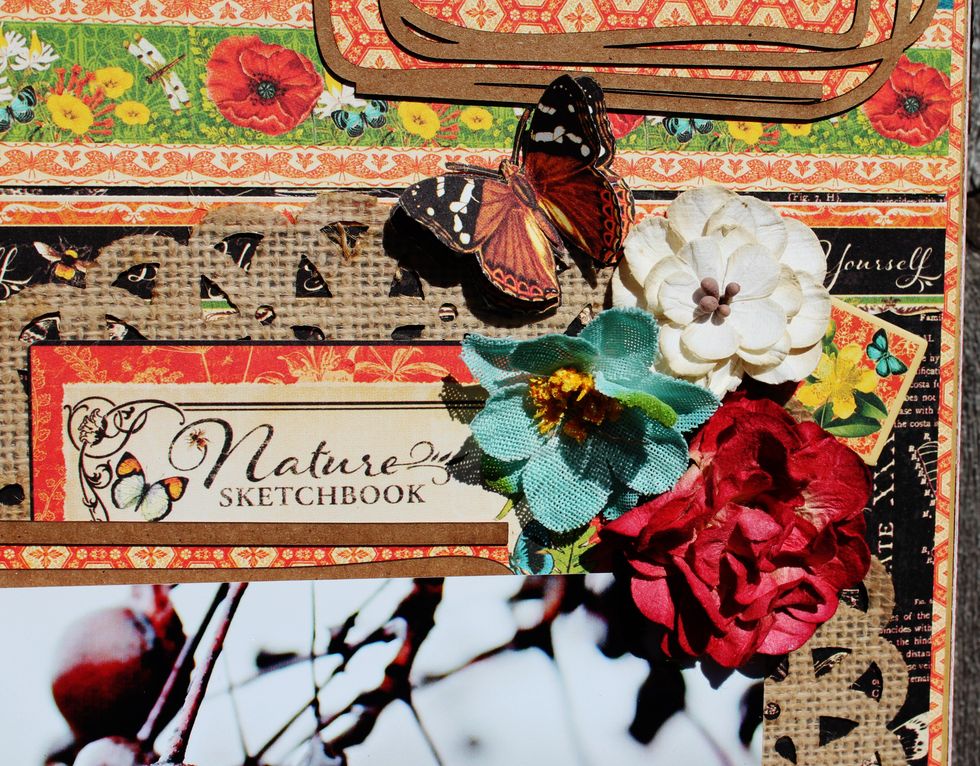 Add flowers and butterflies to top of frame.