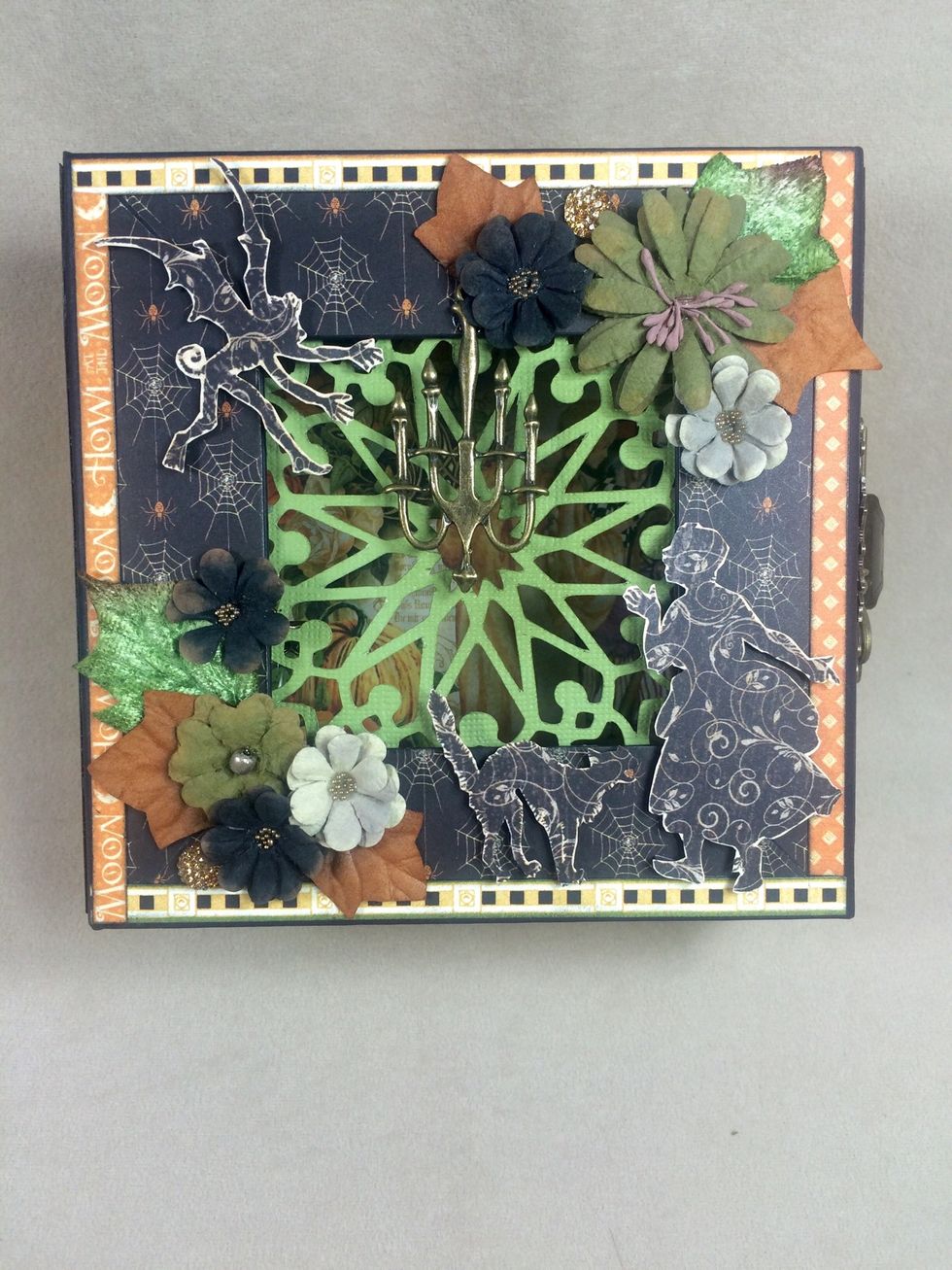 Add flowers and leaves to the box front, as desired.