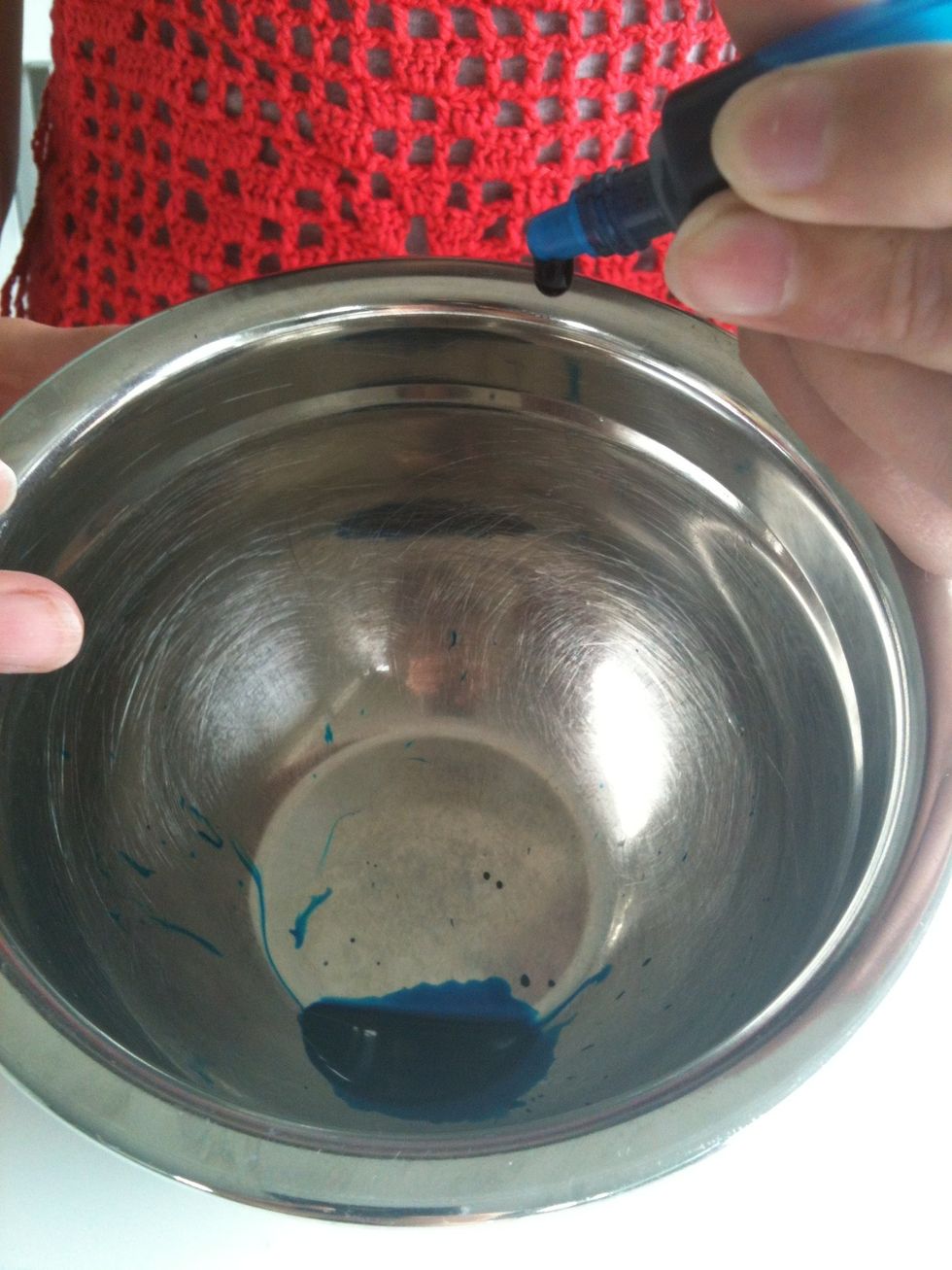 Add food dye into a small bowl with a little water. Less water creates a deeper colour.