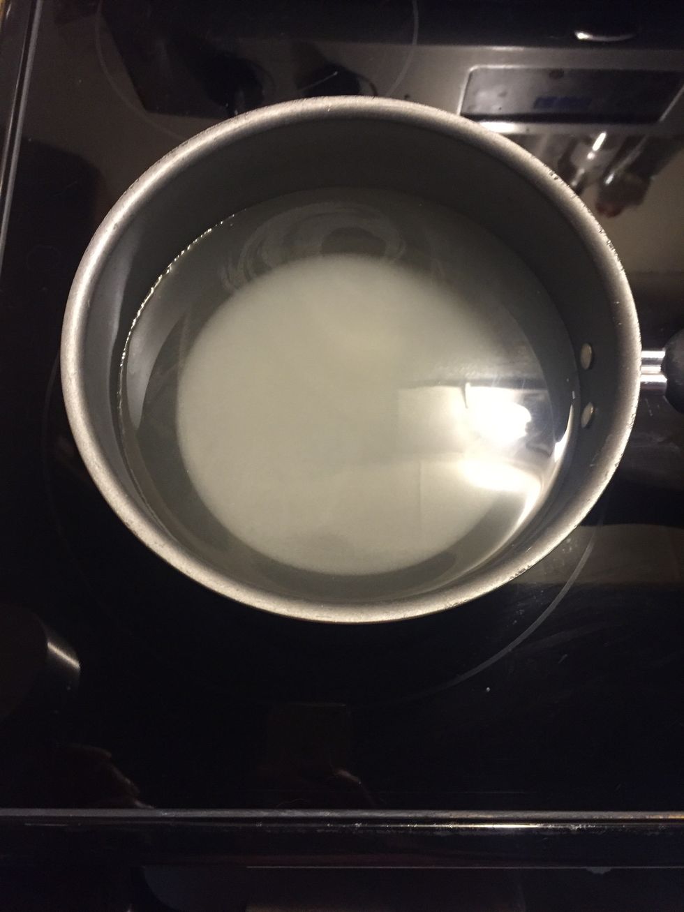 Add four cups hot water to pot. You can use cold, but the myth that cold water boils faster than hot is just that! Hot water will get the job done quicker.