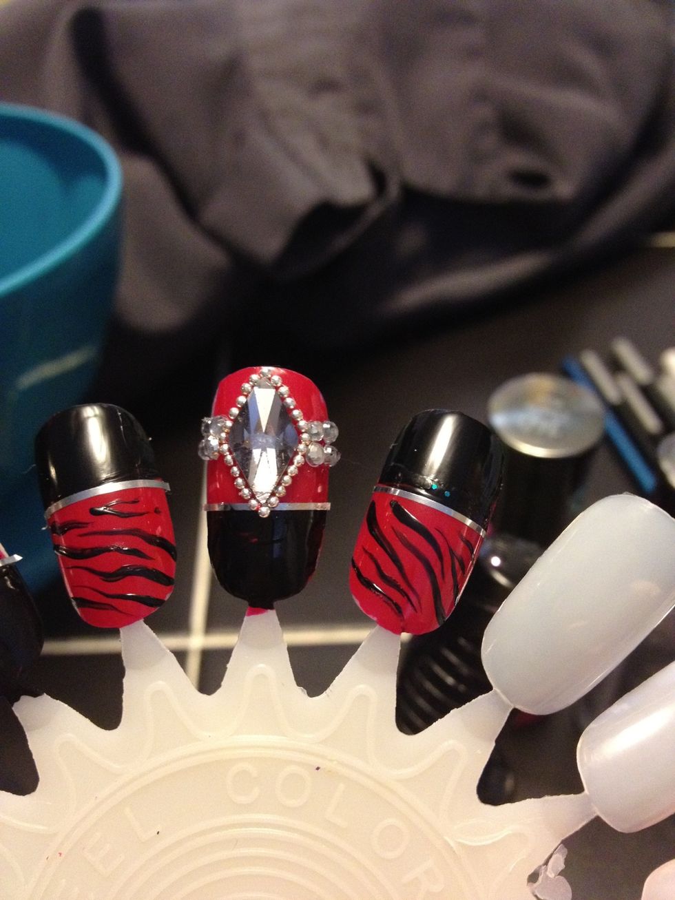 Add four medium sized rhinestones on each side