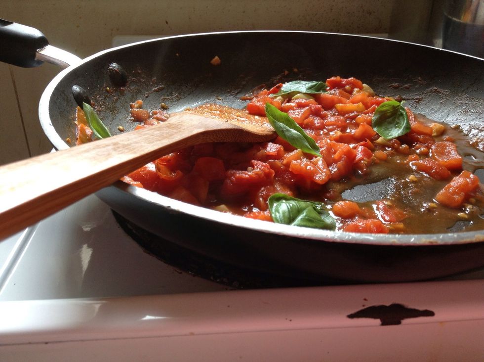 Add fresh, rinsed basil leaves - UNCHOPPED (unless you insist on chopping them...but don't!)