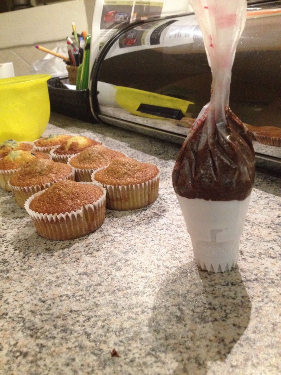 Add frosting to a piping bag and frost your banana muffins!