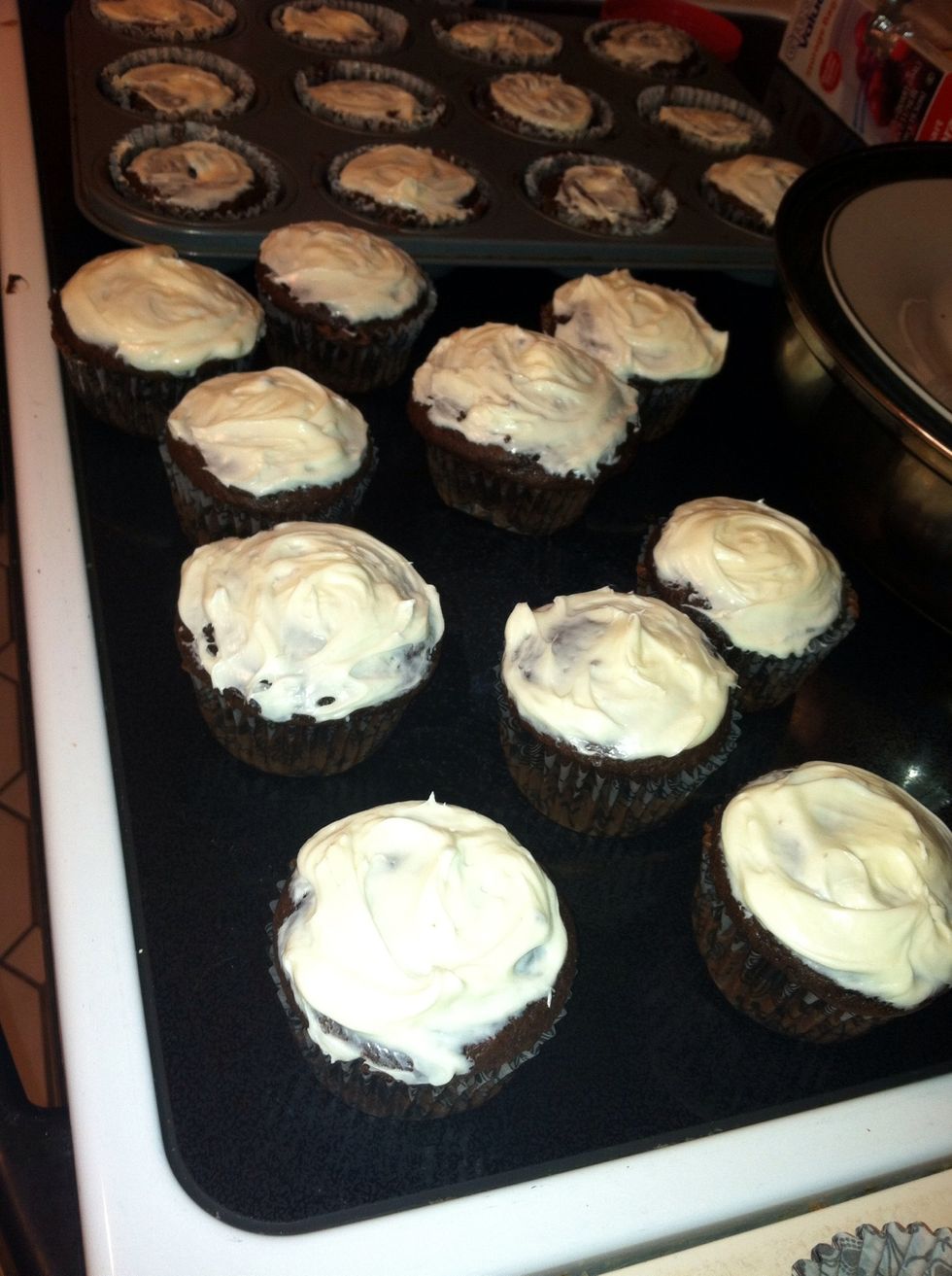 Add frosting to the tops of the cupcakes