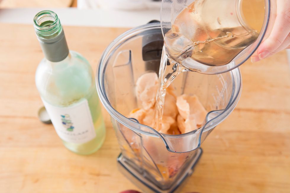 Add frozen peaches to your blender. Then, add two cups of chilled Sauvignon Blanc. You can also add a little peach gelato to give your slushies an extra punch of flavor. Blend well.