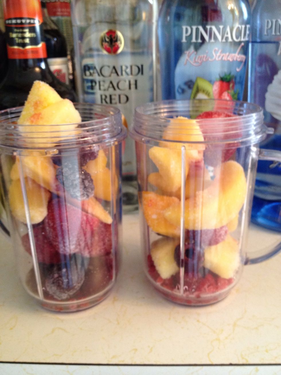 Add fruit almost to the top of your magic bullet cup (the one on the left is a bit full)