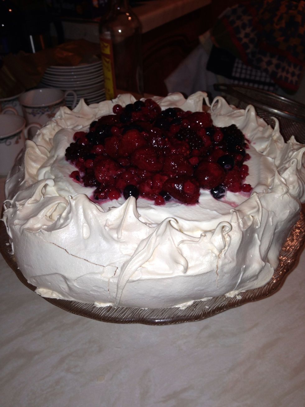 Add fruit to the cream and serve. Please note - you can add anything you like to the pavlova - we use summer fruits, this is my Mum's recipe and a family favourite!