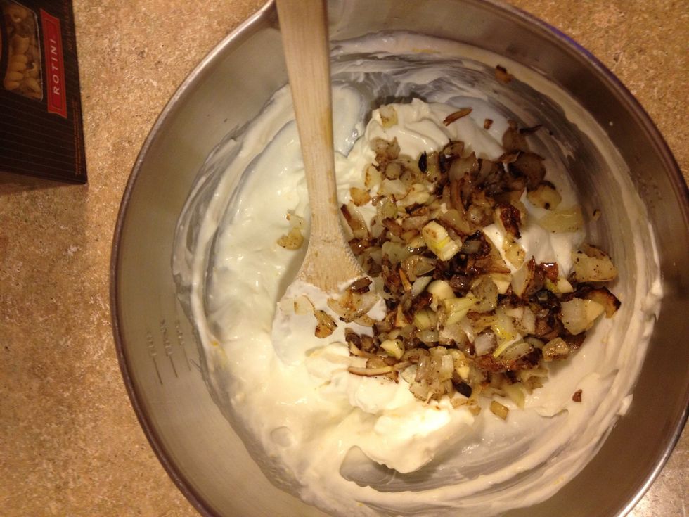 Add garlic and onions , mix well