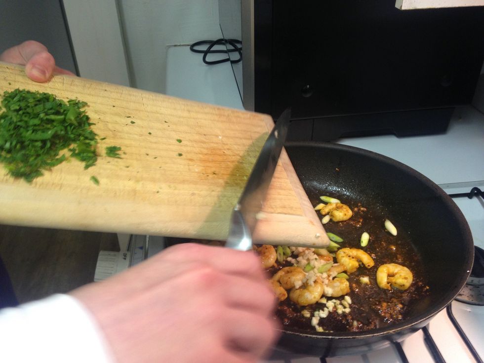 Add garlic and spring onion to the cous cous