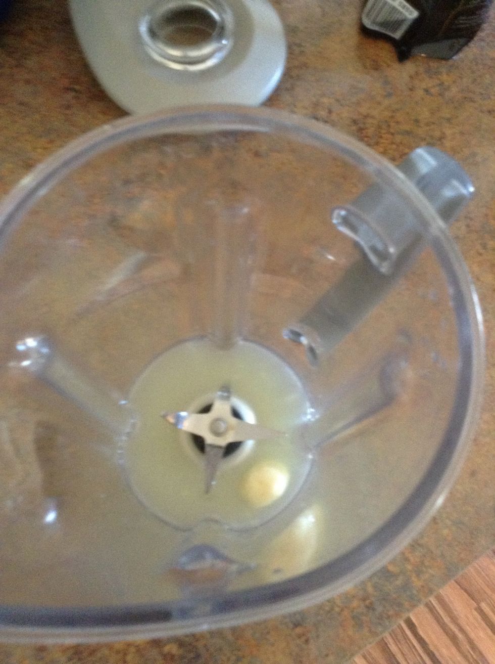 Add garlic cloves to blender.
