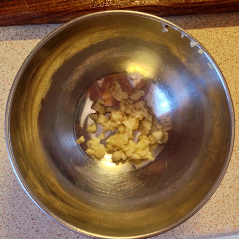 Add garlic in the bowl.