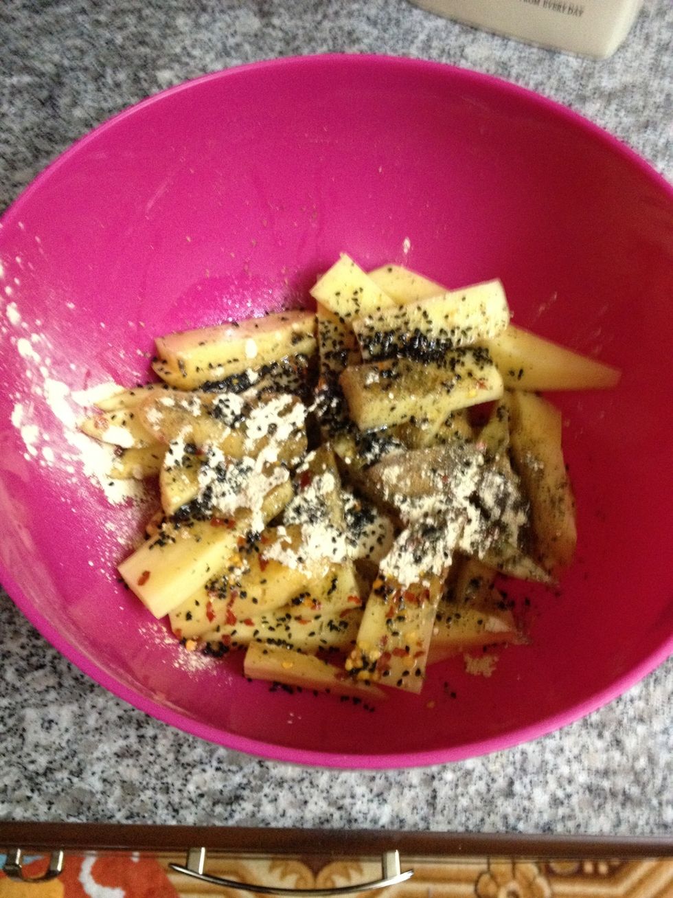 Add garlic powder, onion seeds, olive oil, lemon juice, black pepper, salt, red chili flakes and mixed herbs