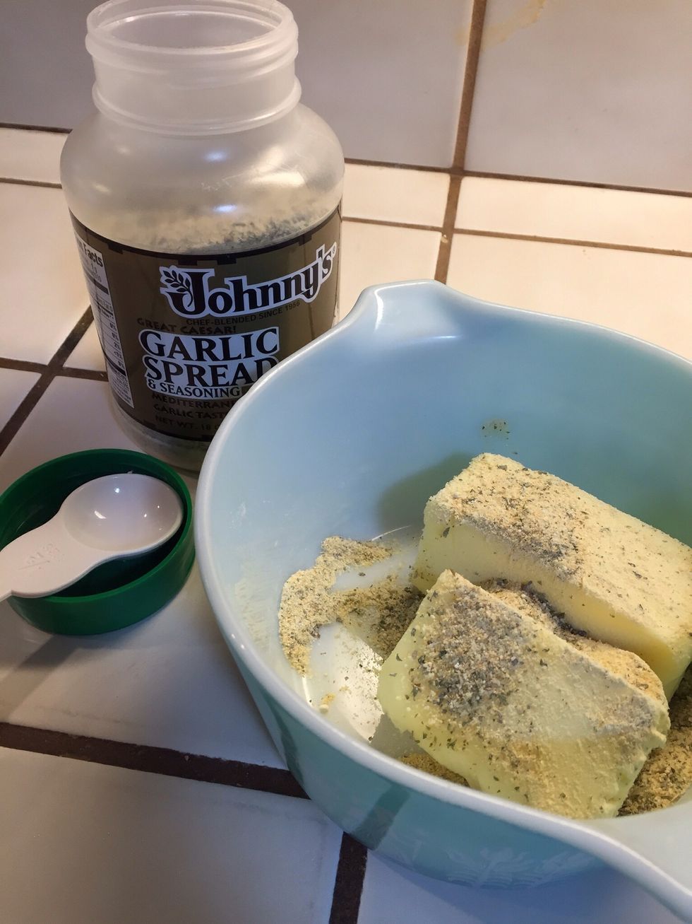 Add garlic spread seasoning mix to softened butter.