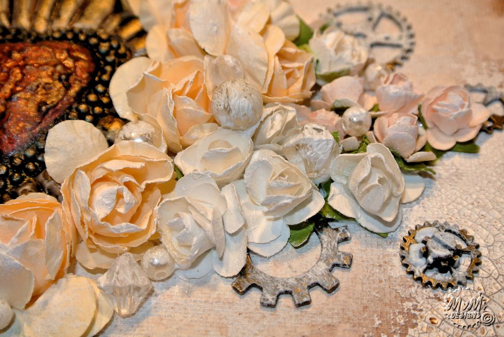 Add Gesso on top of all the embellishments (with a brush).