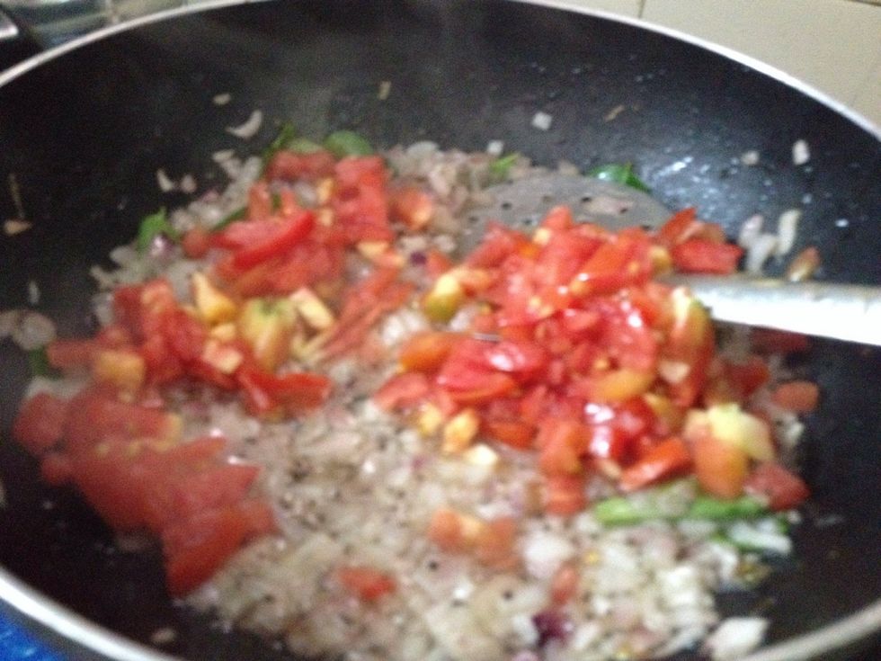 Add ginger garlic paste and saute well then add chopped tomatos and green chilli