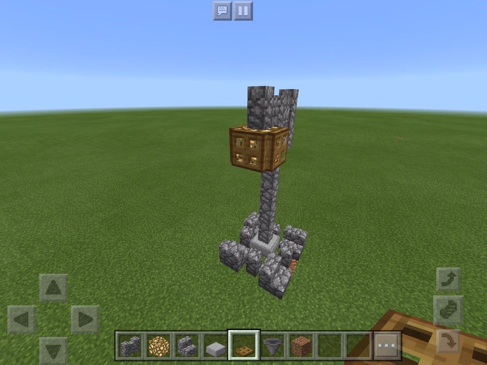 Add glowstone or a sea lantern as shown and then add 3 trap doors around it.